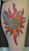 stained_glass_sun_spiral_tattoo.JPG